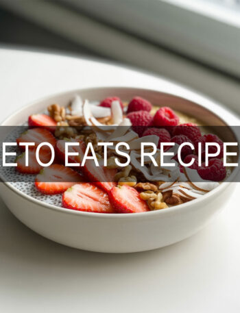 Keto berry coconut chia pudding in a white bowl with strawberries and toasted coconut