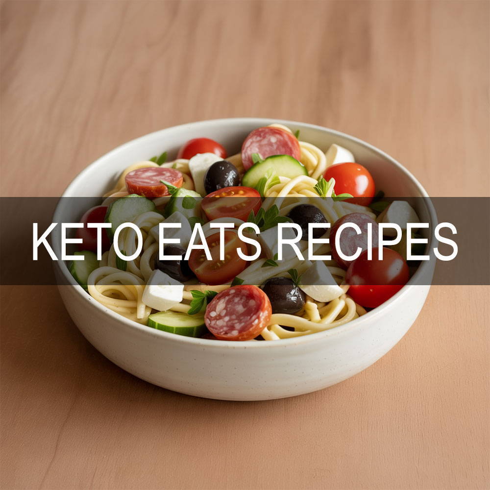 Keto Italian Pasta Salad with Palmini noodles, salami, mozzarella, and veggies in a white bowl